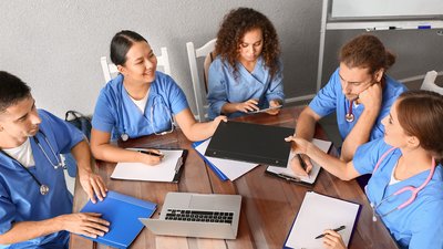 nurses around a table