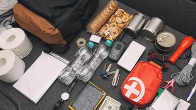 Emergency backpack equipment organized on the table