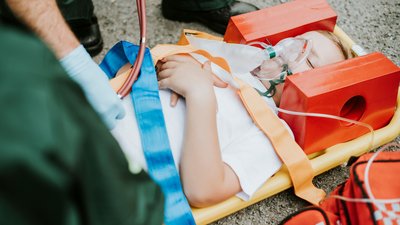 Paramedic team rescuing a young critical patient 2