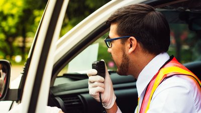 Rescuers radio communication with car